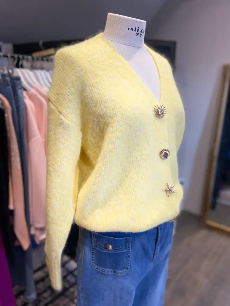 Geel gebreid vest met detailknopen